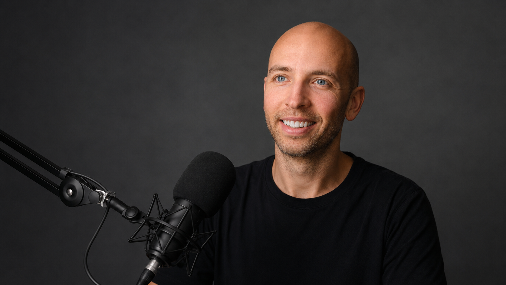 Brian Dean speaking into a studio microphone